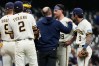 Milwaukee Brewers starting pitcher Chad Patrick (39) is checked by a team trainer during the second inning of a baseball game against the Arizona Diamondbacks, Tuesday, April 28, 2026, in Milwaukee. (AP Photo/Nam Y. Huh)