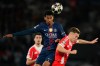 PSG's Senny Mayulu, left, and Bayern's Joshua Kimmich jump for the ball during the Champions League semifinal first leg soccer match between Paris Saint-Germain and Bayern Munich in Paris, Tuesday, April 28, 2026. (AP Photo/Christophe Ena)