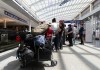 Travellers wait at the Air Canada counter in Montreal-Pierre Elliott Trudeau International Airport in Dorval, Que., Friday, Aug. 15, 2025. THE CANADIAN PRESS/Christinne Muschi