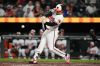 Baltimore Orioles' Adley Rutschman hits an RBI single during the seventh inning of a baseball game against the Houston Astros, Tuesday, April 28, 2026, in Baltimore. (AP Photo/Stephanie Scarbrough)