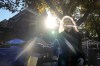Rev. Canon Maggie Helwig stands amid structures as Toronto city workers prepare to clear the unhoused persons encampment at St. Stephen-in-the-Fields Church, in Toronto, on Thursday, Oct. 16, 2025. THE CANADIAN PRESS/Chris Young