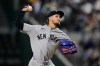 New York Yankees starting pitcher Elmer Rodriguez makes his major league debut as he throws to the Texas Rangers in the first inning of a baseball game Wednesday, April 29, 2026, in Arlington, Texas. (AP Photo/Tony Gutierrez)