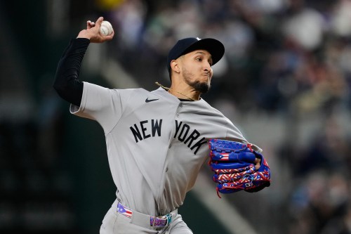 New York Yankees starting pitcher Elmer Rodriguez makes his major league debut as he throws to the Texas Rangers in the first inning of a baseball game Wednesday, April 29, 2026, in Arlington, Texas. (AP Photo/Tony Gutierrez)