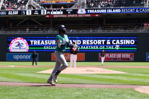 Seattle Mariners J.P. Crawford trots home after hitting a home run during the third inning of a baseball game against the Minnesota Twins, Wednesday, April 29, 2026, in Minneapolis. (AP Photo/Stacy Bengs)