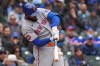 New York Mets' Luis Robert Jr. hits a single during the ninth inning of a baseball game against the Chicago Cubs in Chicago, Sunday, April 19, 2026. (AP Photo/Nam Y. Huh)