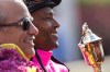 Patrick Husbands (centre) and trainer Mark Casse celebrate after winning the 155th Queen's Plate with Lexie Lou at Woodbine Racetrack in Toronto on Sunday July 6, 2014. THE CANADIAN PRESS/Chris Young