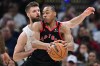 Toronto Raptors forward Scottie Barnes drives on Cleveland Cavaliers forward Dean Wade during the second half in Game 5 of a first-round NBA playoffs basketball series, Wednesday, April 29, 2026, in Cleveland. (AP Photo/David Dermer)