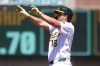 Athletics' Nick Kurtz gestures after hitting an RBI double during the second inning of a baseball game against the Kansas City Royals Thursday, April 30, 2026, in West Sacramento, Calif. (AP Photo/Scott Marshall)