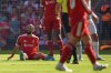 Liverpool's Mohamed Salah smiles as he sits on the pitch after getting injured during the English Premier League soccer match between Liverpool and Crystal Palace in Liverpool, England, Saturday, April 25, 2026. (AP Photo/Ian Hodgson)