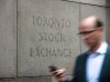 A man walks past a building in Toronto that used to house the Toronto Stock Exchange on Aug. 18, 2011. THE CANADIAN PRESS/Aaron Vincent Elkaim