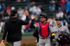Arizona Diamondbacks catcher Gabriel Moreno (14) high-fives a teammate before a baseball game against the Chicago Cubs, Friday, May 1, 2026, in Chicago. (AP Photo/Erin Hooley)