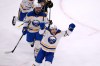 Buffalo Sabres centre Peyton Krebs, front, celebrates after a goal by Mattias Samuelsson during the first period in Game 6 of a first-round NHL hockey Stanley Cup playoff series against the Boston Bruins, Friday, May 1, 2026, in Boston. (AP Photo/Charles Krupa)