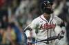 Atlanta Braves pinch hitter Michael Harris II follows the flight of his two-run home run off Colorado Rockies relief pitcher Juan Mejia in the ninth inning of a baseball game Friday, May 1, 2026, in Denver. (AP Photo/David Zalubowski)