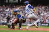Seattle Mariners catcher Cal Raleigh misses the throw at the plate and Kansas City Royals' Maikel Garcia (11) scores on an RBI single from Vinnie Pasquantino during the first inning of a baseball game, Friday, May 1, 2026, in Seattle. (AP Photo/Lindsey Wasson)