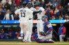 From left to right, Detroit Tigers' Dillon Dingler celebrates after his three-run home run with Riley Greene and Colt Keith as Texas Rangers catcher Danny Jansen looks on during the first inning of a baseball game Saturday, May 2, 2026, in Detroit. (AP Photo/Paul Sancya)