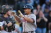 Atlanta Braves' Drake Baldwin, right, celebrates as he crosses home plate after hitting a two-run home run off Colorado Rockies starting pitcher Brennan Bernardino in the first inning of a baseball game Saturday, May 2, 2026, in Denver. (AP Photo/David Zalubowski)