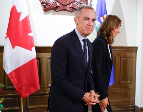 Prime Minister Mark Carney, left, meets with Alberta Premier Danielle Smith in Calgary, Alta., Thursday, Nov. 27, 2025. THE CANADIAN PRESS/Jeff McIntosh