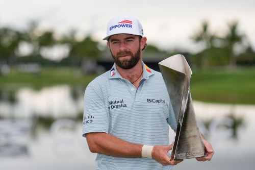 Cameron Young holds the trophy after winning the Cadillac Championship PGA golf tournament Sunday, May 3, 2026, in Doral, Fla. (AP Photo/David J. Phillip)