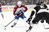 Colorado Avalanche's Cale Makar (8) brings the puck across the blue line against Los Angeles Kings during the first period of Game 4 in the first round of an NHL hockey Stanley Cup playoff series Sunday, April 26, 2026, in Los Angeles. (AP Photo/Scott Strazzante)