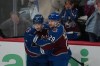 Colorado Avalanche defenseman Cale Makar, left, congratulates center Nathan MacKinnon after he scored a goal against the Minnesota Wild in the third period of Game 1 of an NHL hockey Stanley Cup second-round playoff series Sunday, May 3, 2026, in Denver. (AP Photo/David Zalubowski)