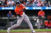 Houston Astros' Yainer Diaz hits an RBI single during the eighth inning in the first baseball game of a doubleheader against the Baltimore Orioles, Thursday, April 30, 2026, in Baltimore. (AP Photo/Stephanie Scarbrough)