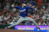 Los Angeles Dodgers starting pitcher Yoshinobu Yamamoto (18) throws during the fourth inning of a baseball game against the Houston Astros in Houston, Monday, May 4, 2026. (AP Photo/Ashley Landis)