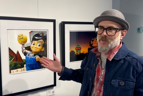 Photographer David J. Schwartz discusses photos he has made while traveling Route 66 over two decades, during an exhibition opening in Springfield, Ill., on March 27, 2026. (AP Photo/John O'Connor)