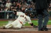 San Francisco Giants' Luis Arraez scores against the San Diego Padres on Rafael Devers' sacrifice fly during the sixth inning of a baseball game Monday, May 4, 2026, in San Francisco. (AP Photo/Godofredo A. Vásquez)
