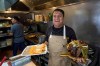 Mexican restaurant owner-chef Marco Mendoza prepares a hot molcajete, a traditional Mexican dish, at Cuernavaca's Grill in downtown Los Angeles, Tuesday, April 28, 2026. (AP Photo/Damian Dovarganes)