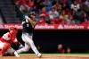Chicago White Sox's Munetaka Murakami (5) follows through on his swing after hitting a double during the sixth inning of a baseball game against the Los Angeles Angels, Monday, May 4, 2026, in Anaheim, Calif. (AP Photo/Jessie Alcheh)