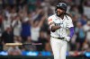 Seattle Mariners' J.P. Crawford celebrates after hitting a two-run home run against the Atlanta Braves during the sixth inning of a baseball game, Monday, May 4, 2026, in Seattle. (AP Photo/Lindsey Wasson)