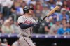 Atlanta Braves' Jonah Heim follows the flight of his double to drive in two runs off Colorado Rockies relief pitcher Jimmy Herget in the ninth inning of a baseball game, Sunday, May 3, 2026, in Denver. (AP Photo/David Zalubowski)