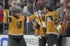 Vegas Golden Knights center Brett Howden, second from left, celebrates after scoring against the Anaheim Ducks during the second period of Game 1 of a second-round NHL hockey Stanley Cup playoff series Monday, May 4, 2026, in Las Vegas. (AP Photo/John Locher)