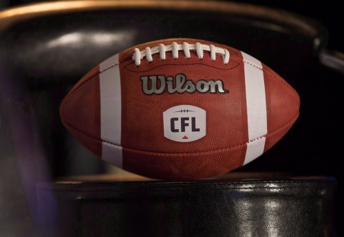 A football with the new CFL logo sits on a chair during a press conference in Winnipeg, Friday, November 27, 2015. The CFL and its member clubs have pledged to donate over $4 million to amateur football this year. The league made the announcement Wednesday during its GM and presidents meetings. THE CANADIAN PRESS/John Woods