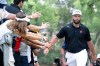Captain Jon Rahm, right, of Legion XIII, greets fans as he walks to the sixth tee during the final round of LIV Golf Mexico City at Club de Golf Chapultepec on Sunday, April 19, 2026 in Naucalpan, Mexico. (Photo by Charles Laberge/LIV Golf via AP)