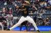 FILE - Pittsburgh Pirates pitcher Chris Devenski deliver a pitch against the Cincinnati Reds in the sixth inning of a baseball game in Pittsburgh, Saturday, May 2, 2026. (AP Photo/Tom E. Puskar, File)