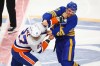 FILE — New York Islanders left wing Anders Lee (27) and Buffalo Sabres centre Sam Carrick (10) fight during the third period of an NHL hockey game, March 31, 2026, in Buffalo, N.Y. (AP Photo/Jeffrey T. Barnes, File)