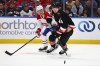 Sabres defenceman Bowen Byram (4) is pressured by Canadiens left wing Alexandre Texier (85). (AP Photo/Jeffrey T. Barnes)