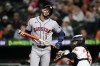 Houston Astros' Carlos Correa (1) reacts after striking out during the seventh inning of a baseball game against the Baltimore Orioles, Tuesday, April 28, 2026, in Baltimore. (AP Photo/Stephanie Scarbrough)