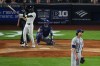 Texas Rangers pitcher Jacob Degrom, right, reacts as New York Yankees' Jazz Chisholm Jr. follows through on a home run during the sixth inning of a baseball game Tuesday, May 5, 2026, in New York. (AP Photo/Frank Franklin II)