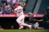 Los Angeles Angels' Mike Trout, left, heads to first for a solo home run as Chicago White Sox catcher Edgar Quero, center, and home plate umpire Jansen Visconti watch during the first inning of a baseball game Tuesday, May 5, 2026, in Anaheim, Calif. (AP Photo/Mark J. Terrill)