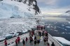 FILE - Passengers watch as a ship sails through the Lemaire Channel in Antarctica, Monday, Nov. 24, 2025. (AP Photo/Mark Baker, File)