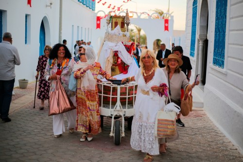 Jewish pilgrims take part in a procession as they attend an annual pilgrimage at the Ghriba synagogue in the resort of Djerba, Tunisia, on Monday, May 4, 2026. (AP Photo/Bassem Aouini)