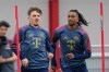 Munich's Lebbart Karl, left, and Michael Olise attend a training session in Munich, Germany, Tuesday, May 5, 2026, ahead of the Champions League semifinal second leg soccer match between FC Bayern and PSG. (AP Photo/Matthias Schrader)