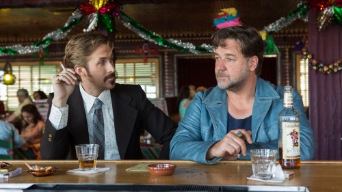 This image released by Warner Bros. shows Ryan Gosling, left, and Russell Crowe in a scene from 