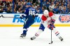 Montreal Canadiens centre Nick Suzuki (14) moves around Tampa Bay Lightning right wing Nikita Kucherov (86) during the first period in Game 5 of an NHL hockey Stanley Cup first-round playoff series, Wednesday, April 29, 2026, in Tampa, Fla. (AP Photo/Chris O'Meara)