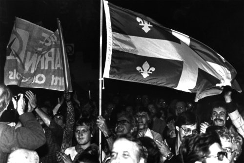 Supporters wave a Quebec flag during a Parti Québécois rally at the Paul Sauvé Arena in Montreal, Oct. 21, 1979. (CP PHOTO/ Doug Ball)