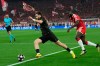 PSG's Khvicha Kvaratskhelia, left, runs with the ball as Bayern's Dayot Upamecano tries to stop him during the Champions League semifinal second leg soccer match between Bayern Munich and Paris Saint Germain in Munich, Germany, Wednesday, May 6, 2026. (AP Photo/Martin Meissner)
