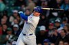 Chicago Cubs' Ian Happ hits a two-run home run during the first inning of a baseball game against the Cincinnati Reds, Wednesday, May 6, 2026, in Chicago. (AP Photo/Erin Hooley)