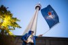 Tadziu Krawiec waves a flag outside Rogers Centre ahead of Game 7 of the World Series between the Blue Jays and Los Angeles Dodgers in Toronto on Nov. 1, 2025. THE CANADIAN PRESS/Nick Iwanyshyn